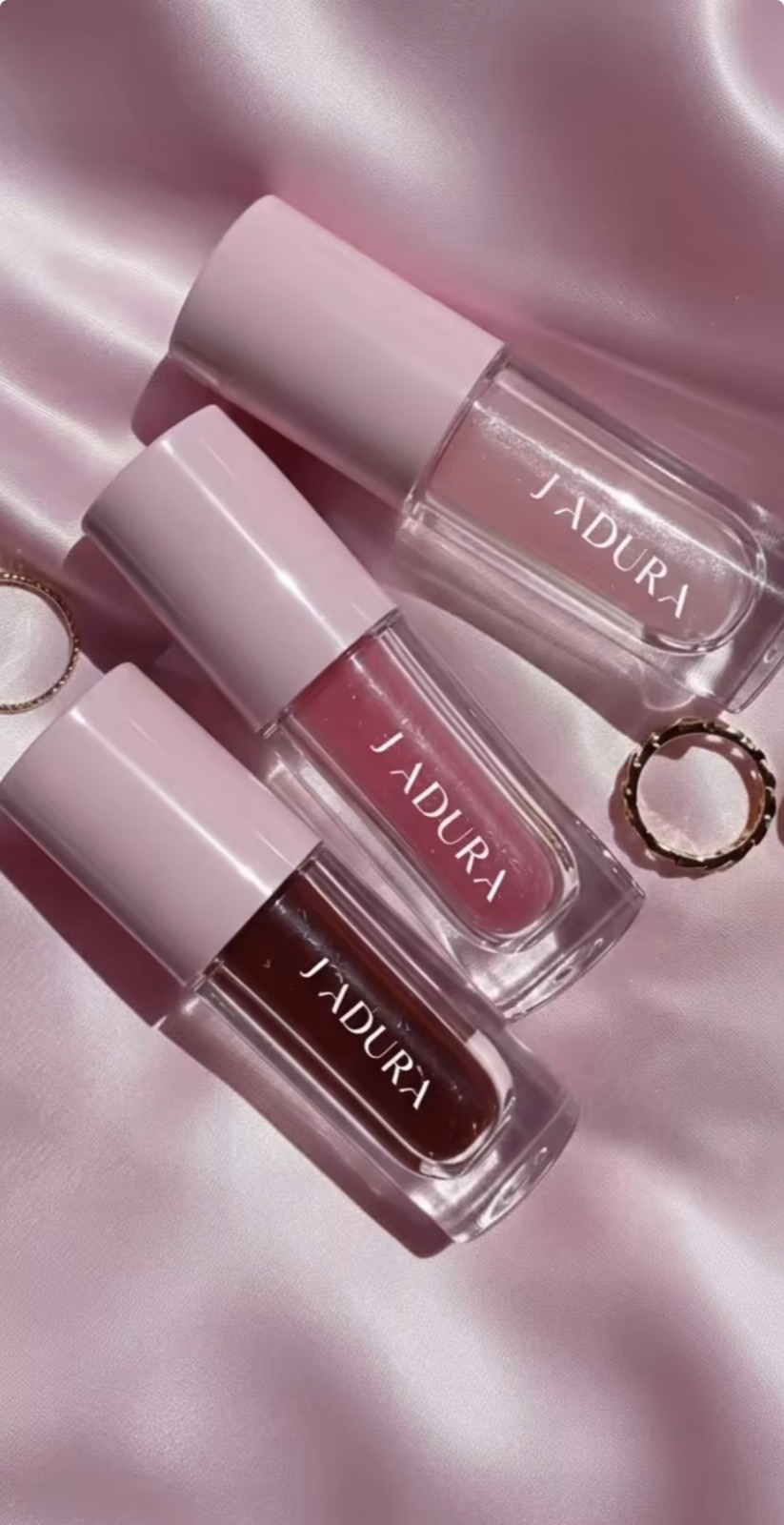 j1adura glosses on pink satin